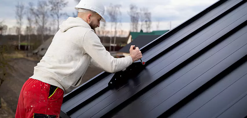Tin Roof Ridge Cap Installation in Fox Island